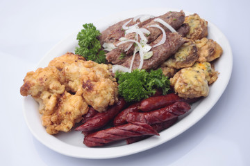 Grilled browned sausages with shish kebabs
