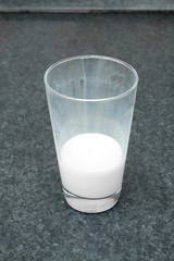 Unfinished glass of milk on the table