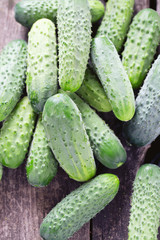fresh cucumbers on wooden table