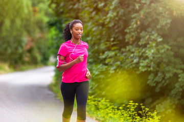  African american woman runner jogging outdoors - Fitness, peopl