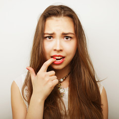 Portrait of a beautiful young woman thinking