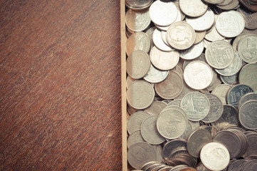 coins on wood with filter effect retro vintage style
