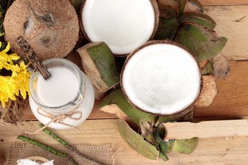 white coconut and milk on wood background