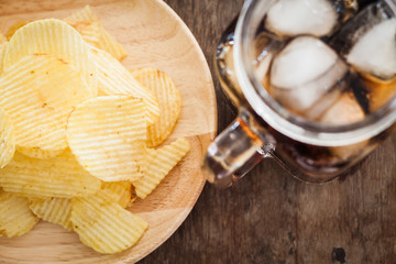 Crispy potato chips with iced cola