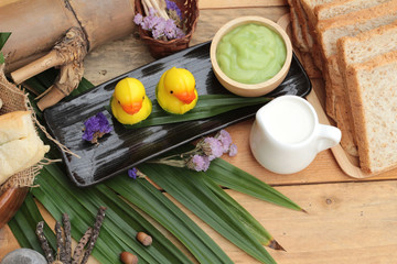 Bread with green custard and fresh milk.