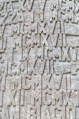 Roman numerals set in stone