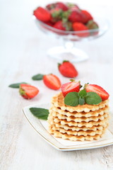 Waffles and ripe strawberries.