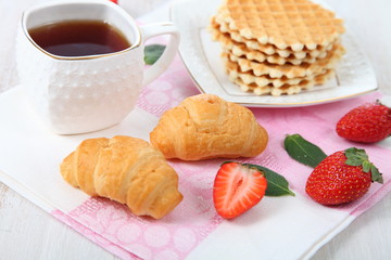 Tea and ripe strawberries