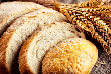 Loaf sliced white bread with ears wheat