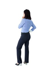 Businesswoman standing and thinking