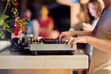 DJ mixing music on console