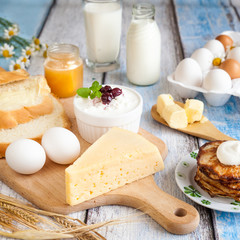 Dairy products, pancakes, honey and fresh eggs