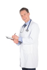 Smiling doctor writing on a clipboard