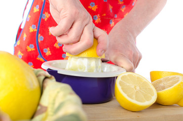 Woman squeezing half a lime