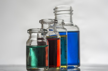 Set of laboratory bottles with color liquid