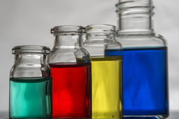 Set of laboratory bottles with color liquid