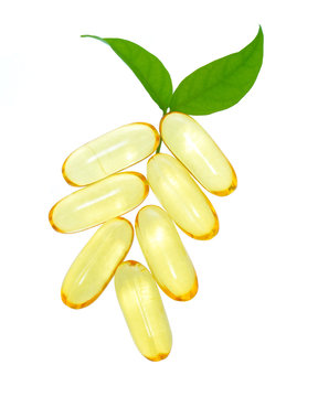 shiny yellow vitamin e fish oil capsule isolated on white backgr