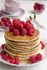 Pancake with sauce and raspberries  
