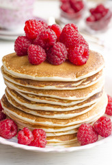 Pancake with sauce and raspberries  