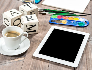 Artistic workplace mockup with black coffee. Painting tools and