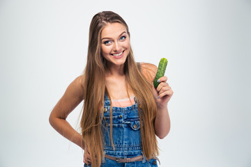 Portrait of a smiling girl holding cucumber