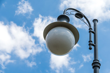 Vintage Street Light Pole Against Blue Sky