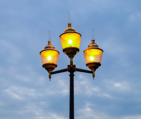 Fototapeta na wymiar Beautiful street lamp on evening sky background