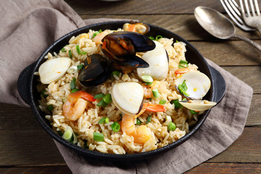 Rice with seafood in a frying pan