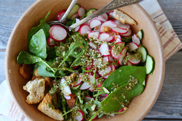 salad with greens and radish in bowl