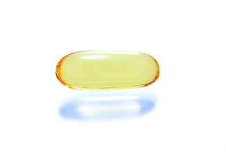 shiny yellow vitamin omega3 fish oil capsule on white  backgroun