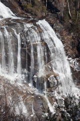 Fototapeta na wymiar Mountain waterfall in winter