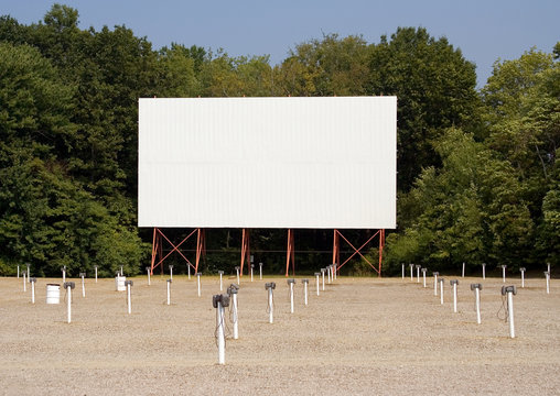 Retro Drive-In Movie Theater – A drive-in movie theater with speaker poles.