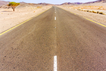 Road through Sahara desert in Sudan.