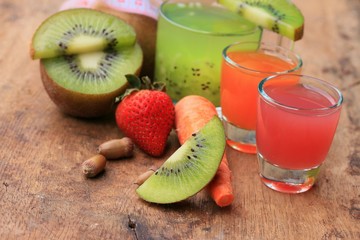 fresh kiwi juice and strawberry on wood vintage