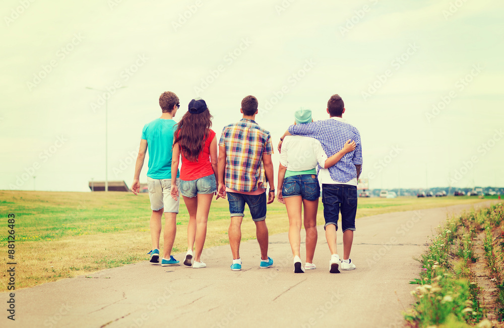 Canvas Prints group of teenagers walking outdoors from back