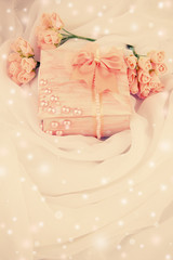 Beautiful hand made casket and flowers on light cloth background