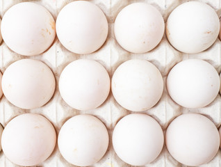Eggs in carton paper on the top view.