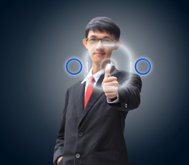 Young business man in a suit pointing with his finger