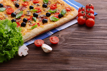 Delicious homemade pizza on table close-up