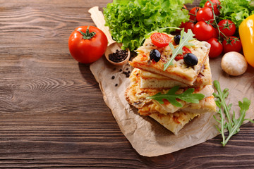 Delicious homemade pizza on table close-up