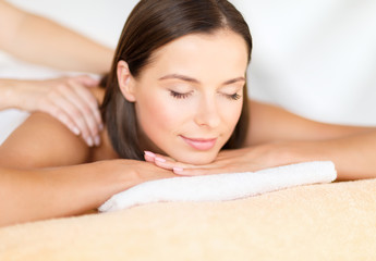beautiful woman in spa salon getting massage