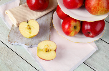 Naklejka na ściany i meble Tasty ripe apples on serving tray on table close up