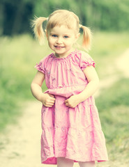 Cute little girl on the meadow 