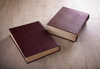 Old books on wooden background