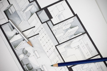 Couple of artistic writing drawing tools shot on regular real estate floor plan showing luxurious approach to interior home design 