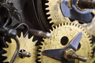Cogwheels Inside Old Clockwork. Macro