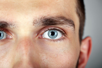 Obraz premium Beautiful blue man eyes close up
