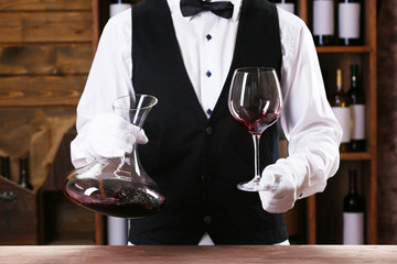 Bartender working at counter on bar background