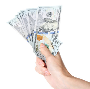 Female hand holding dollars isolated on white