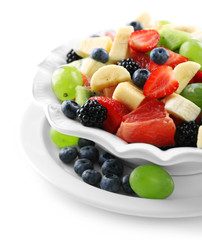 Fresh fruit salad, isolated on white